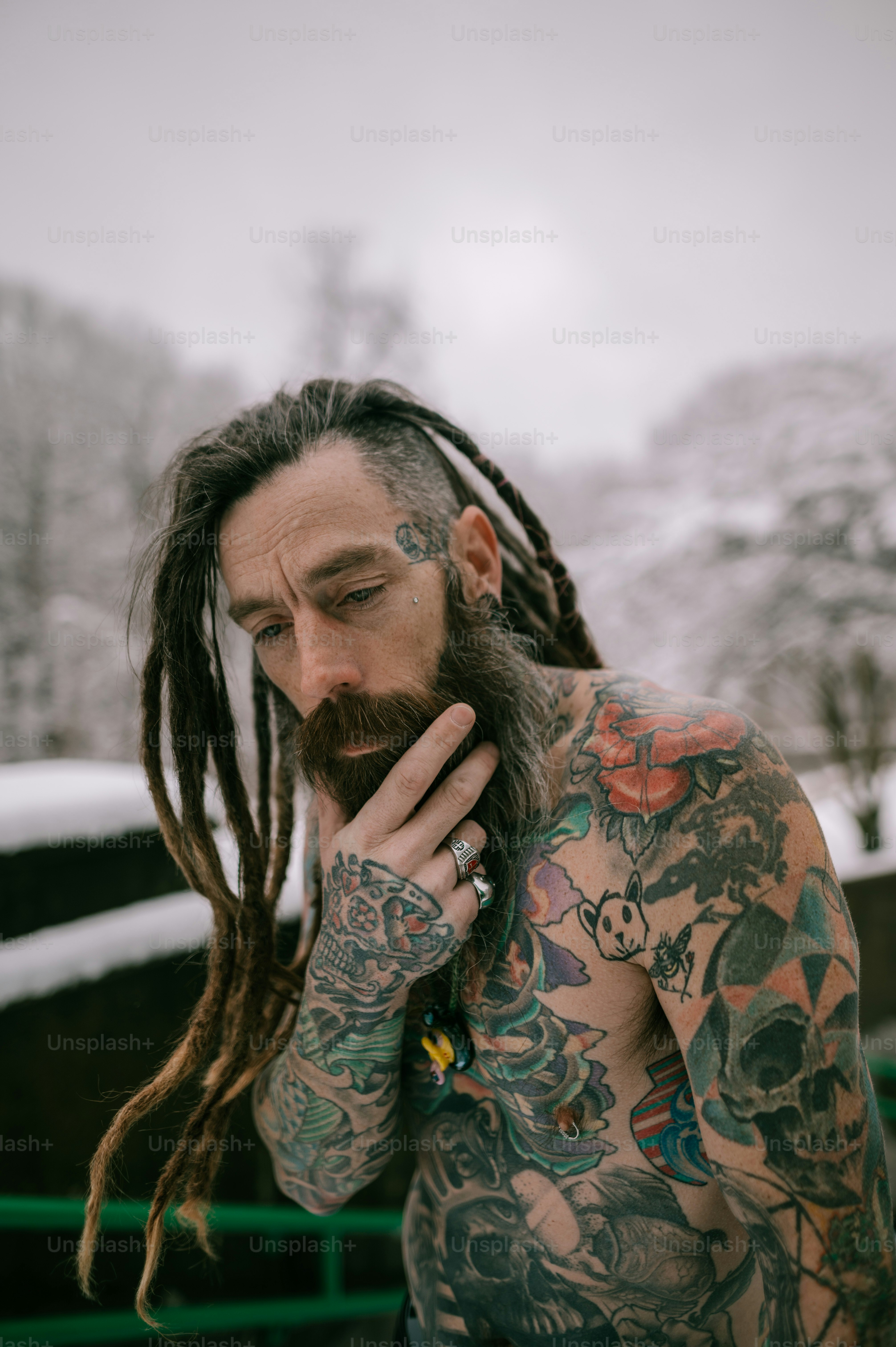 A man with a lot of tattoos on his body photo – Man hair Image on Unsplash